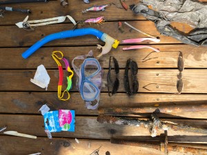 Snorkel, mask, goggles and sunglasses left discarded and lost on the ocean floor