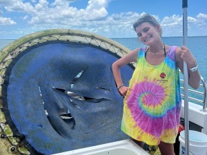 Deckhand Brooke posing with the retrieved debris onboard the Phoenix vessel 