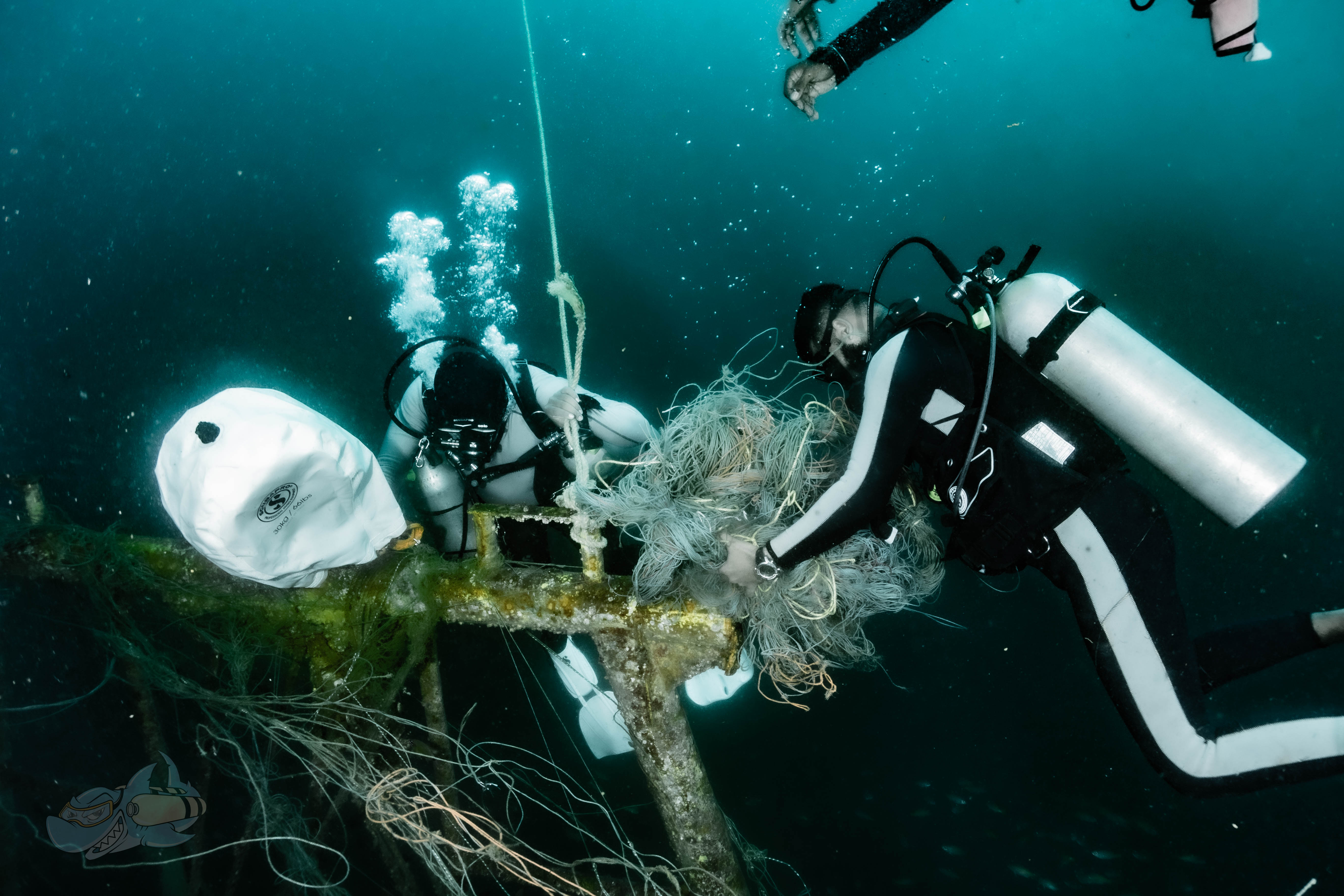 Divers Collecting the debris