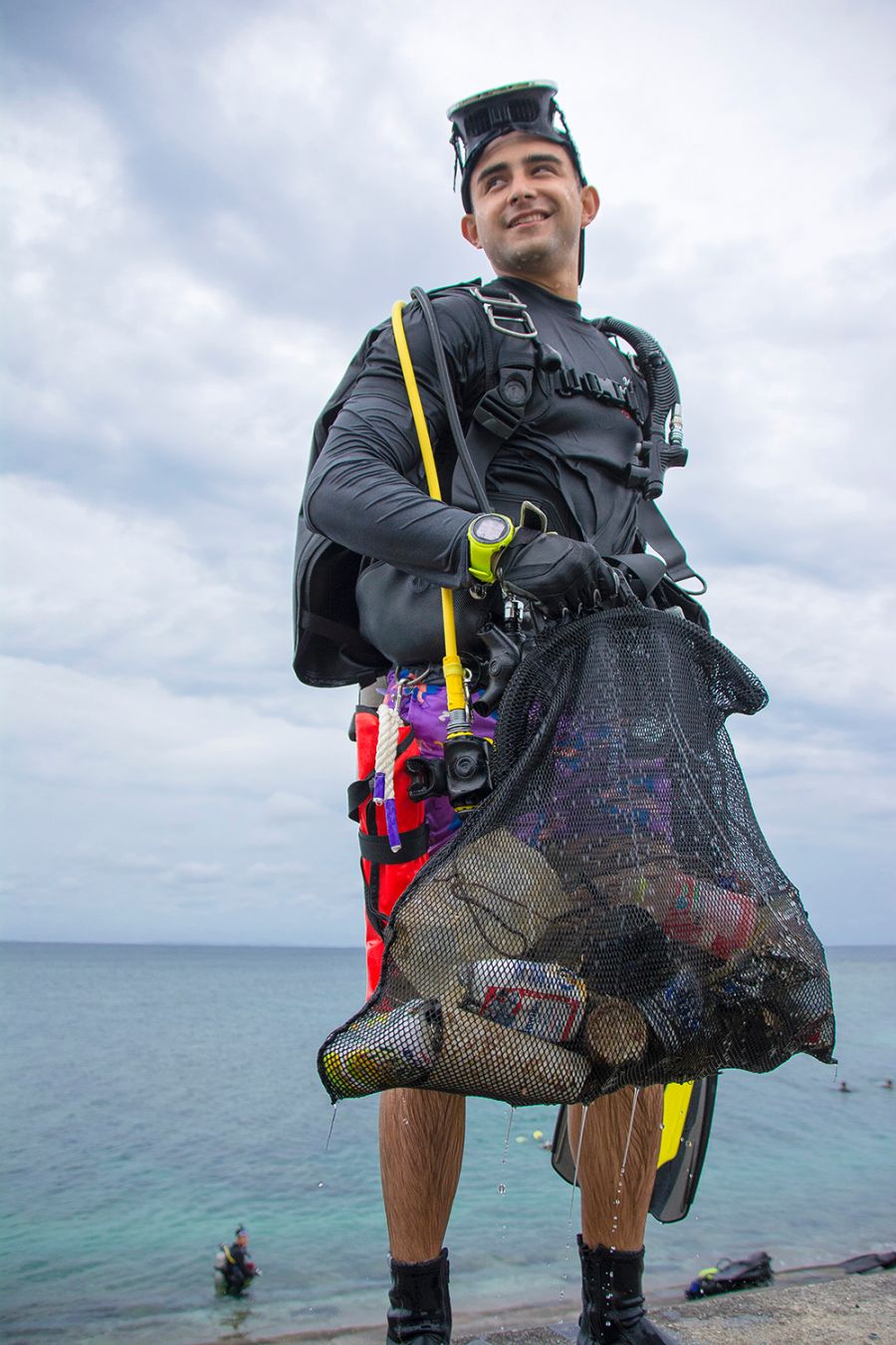 image of diver with mesh bag Okinawa