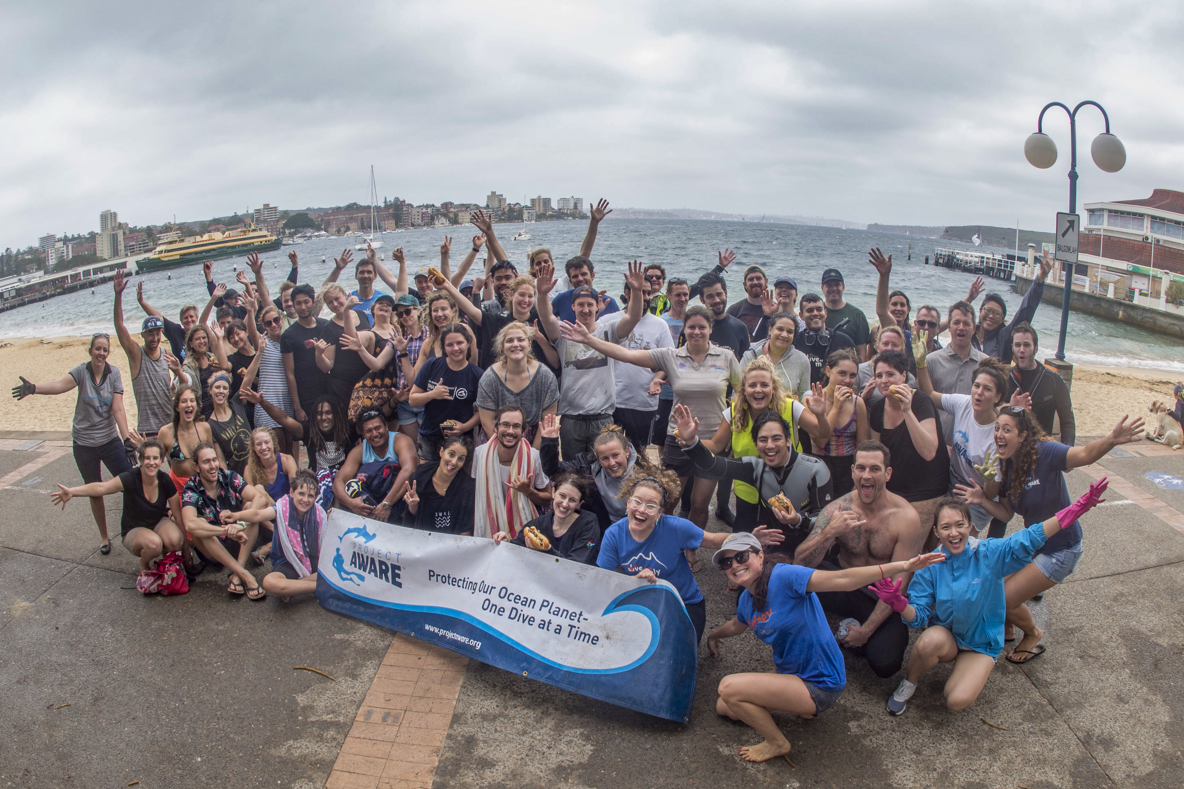 image of dive centre manly Project AWARE banner team photo