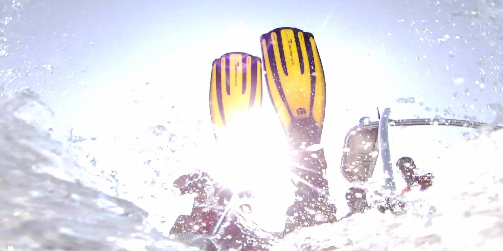 Image of divers jumping underwater