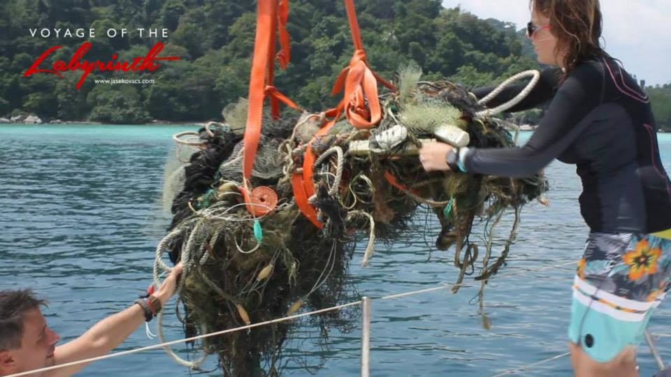 Image of divers removing a ghost net and other debris