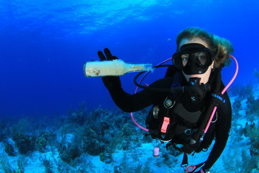 Diver collecting trash