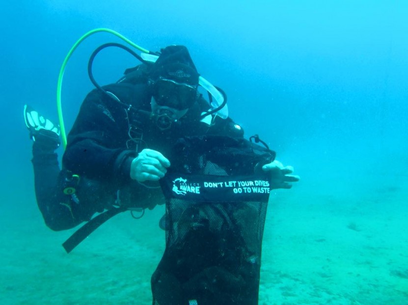 diver cleaning underwater