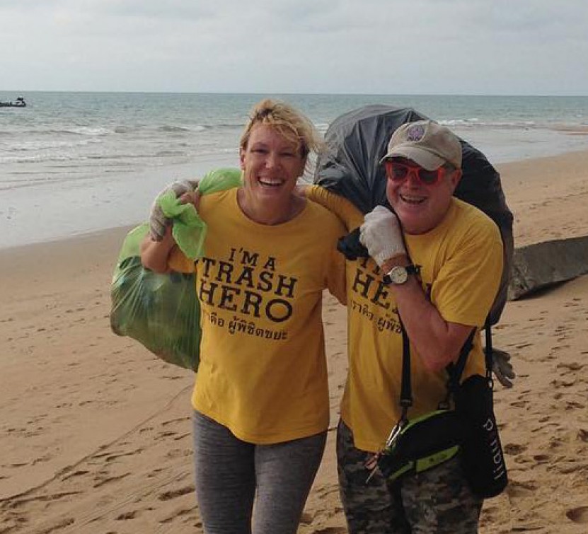 Collecting trash on a beach clean up.