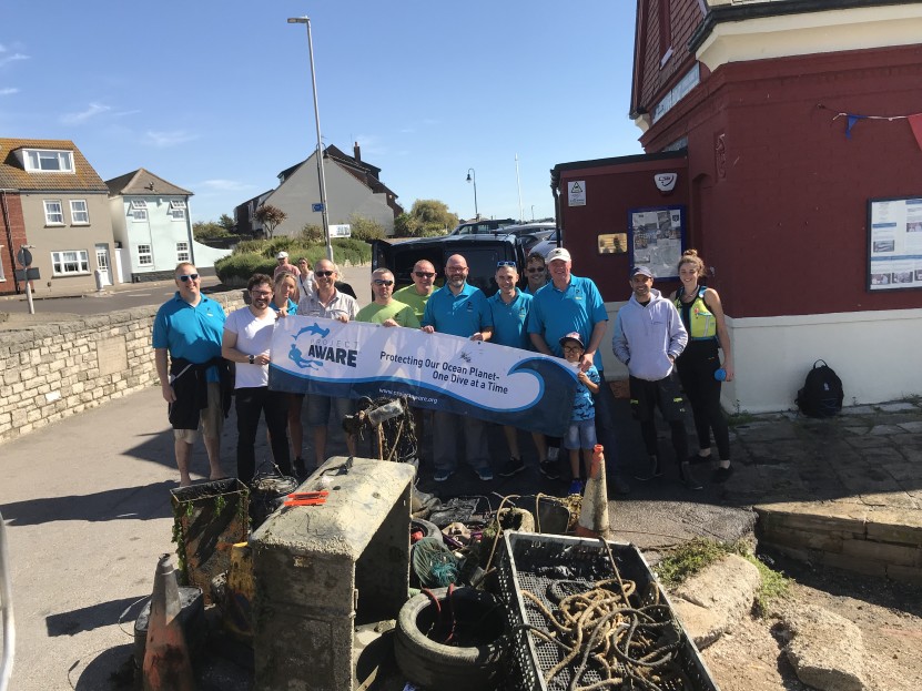 Whole team with Project AWARE banner