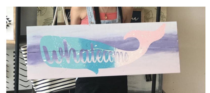 A wood sign craft project painted with a whale.