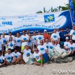 Happy volunteers on the beach after picking up 118 kg of trash from the ocean bed