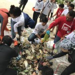 Scuba divers sorting the trash after the dive