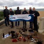 Divers at Mordialloc pier with their debris from the Dive Against Debris